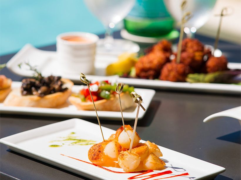 Small plates and drinks by the pool
