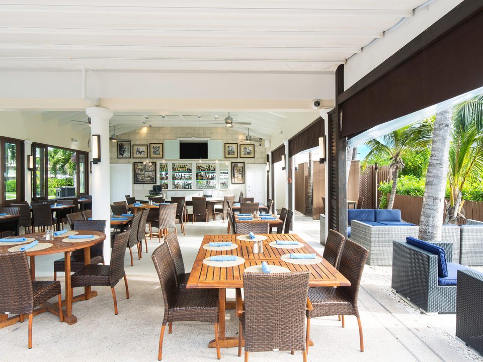 Inside Hemingway's, with tables by the open sides