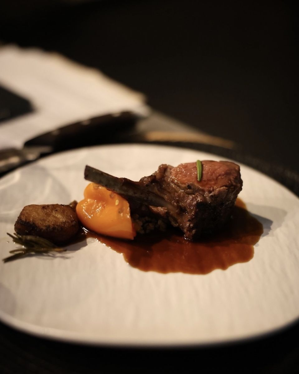 A roasted bone-in chop with a rich jus and a bright purée, a main course at Ode to Gillian