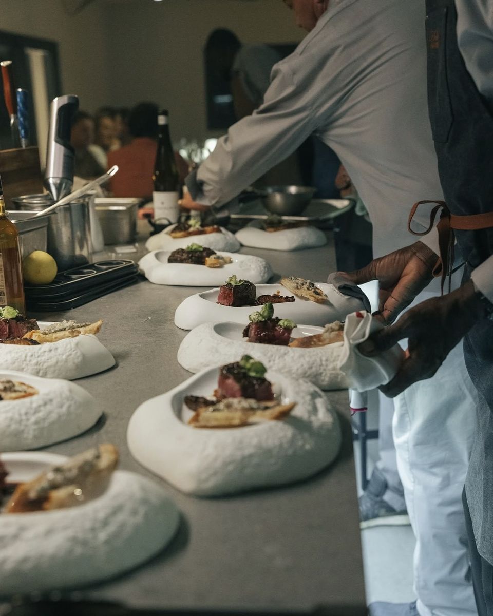 A course lined up on the pass as the kitchen plates for the whole table at Ode to Gillian