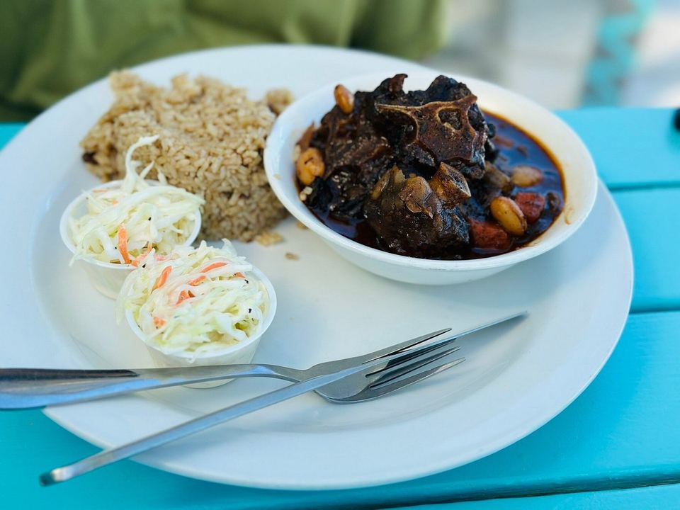 Jamaican oxtail at Omar's Beach Hut, with peas and rice and coleslaw