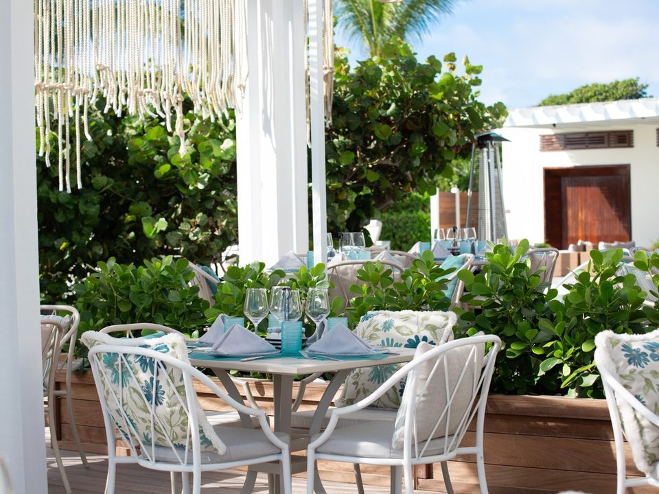 A table set in blue and white at Sea Grapes