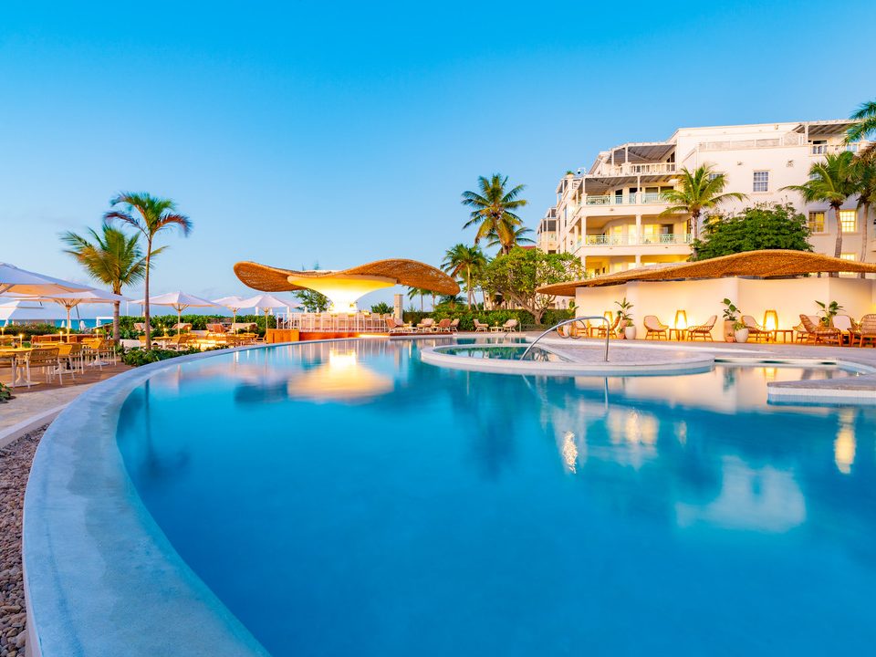 The infinity pool at The Palms, with the resort buildings beyond