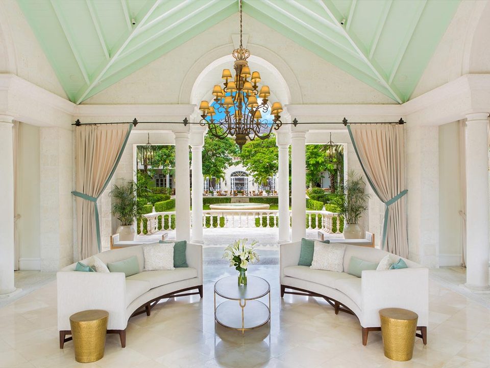 The open-air lobby, with its chandelier and arches looking out to the gardens