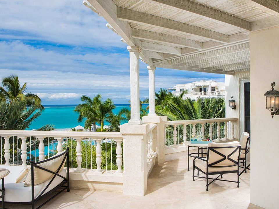 A suite balcony looking over the palms to the sea