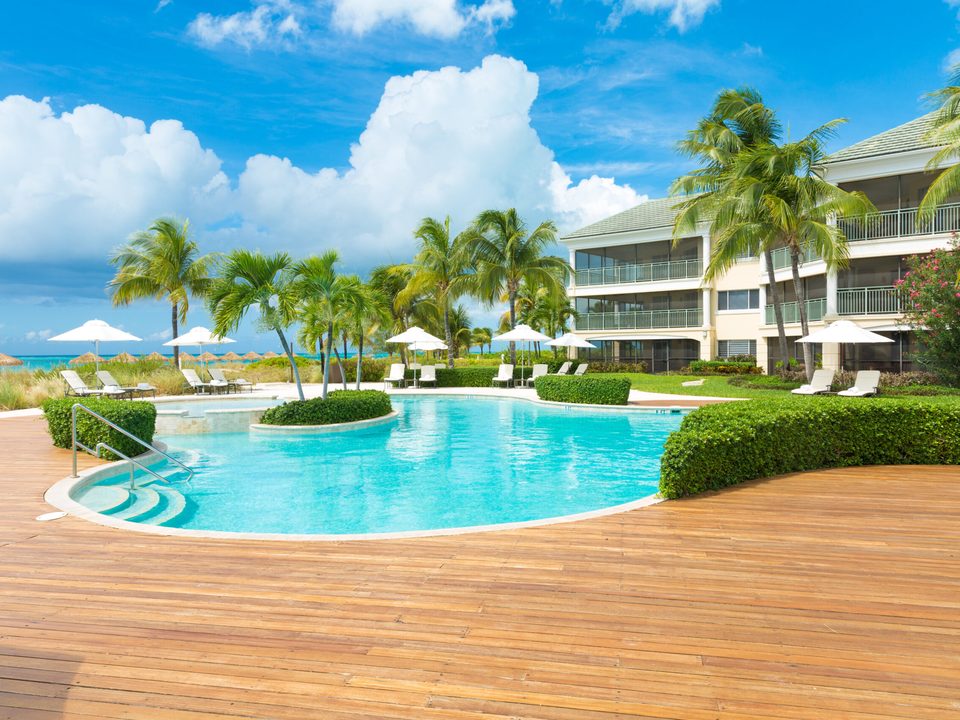 The pool and its wooden deck, with the suites behind