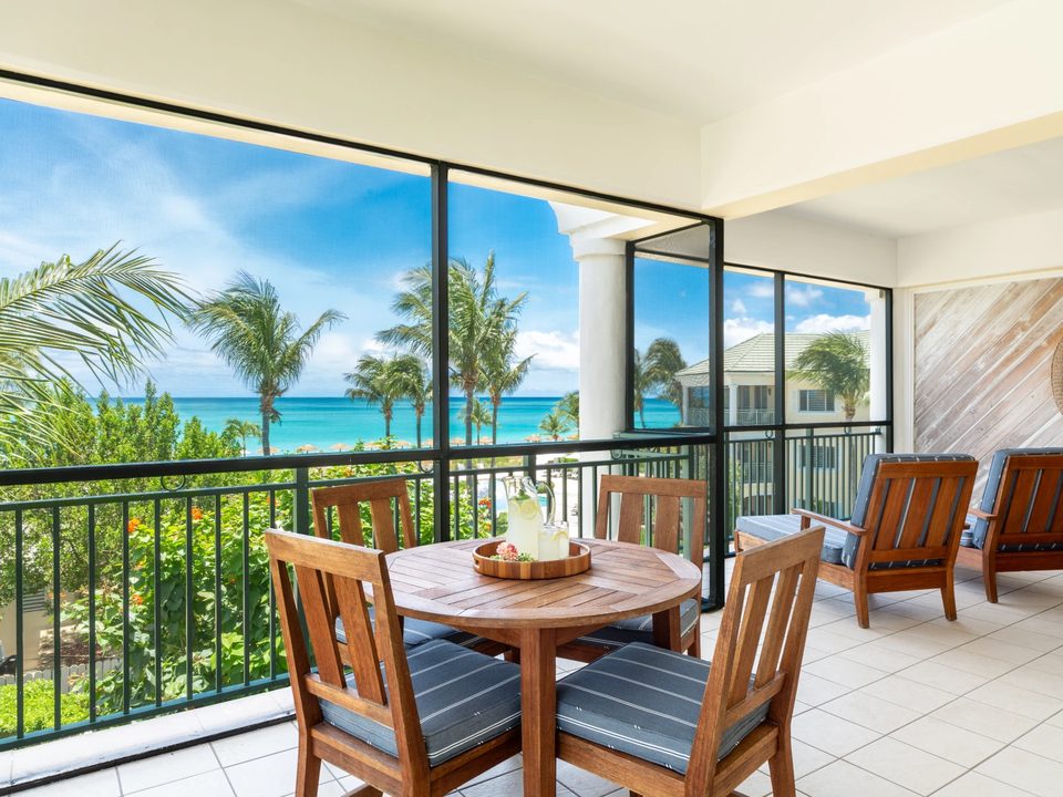 A two-bedroom oceanfront suite's screened balcony