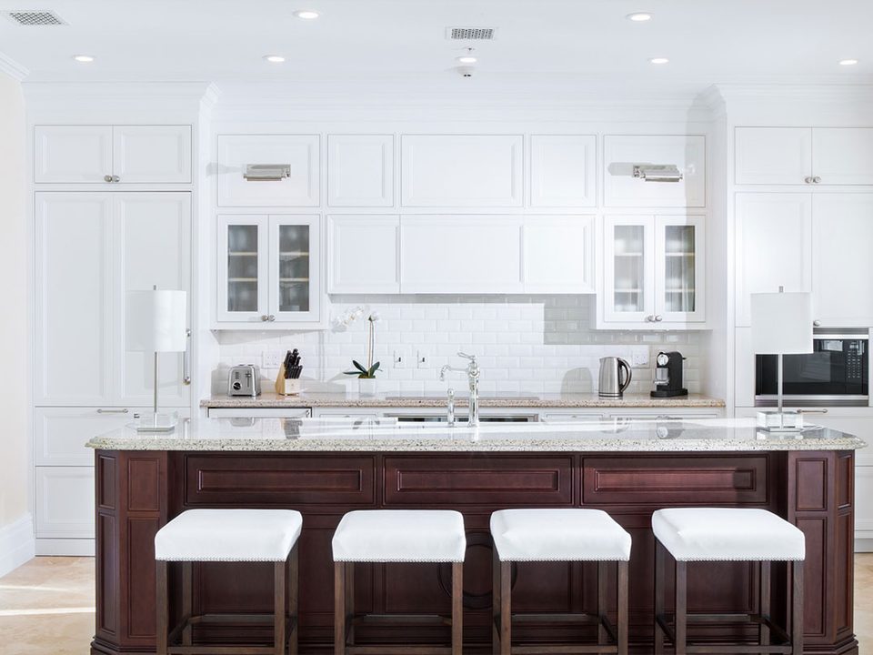 A suite kitchen with a breakfast bar